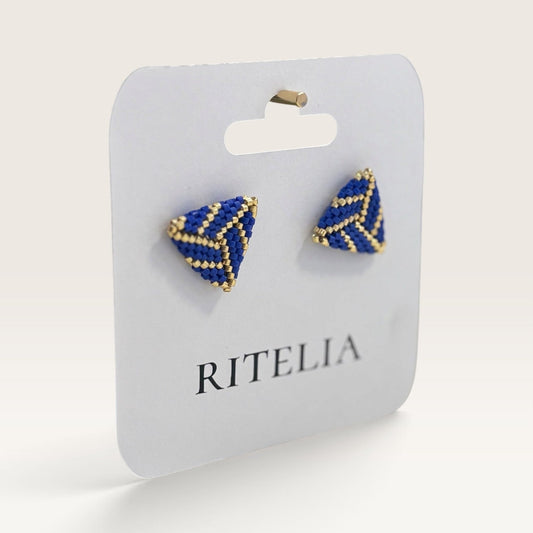 Ritelia handmade triangular stud earrings featuring cobalt blue and gold Miyuki Japanese beads on a display card.