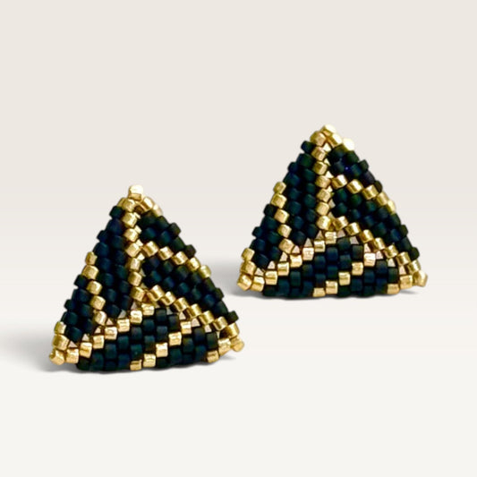 Ritelia Sofía triangle earrings handcrafted with black and gold Japanese Miyuki beads in a geometric pattern.
